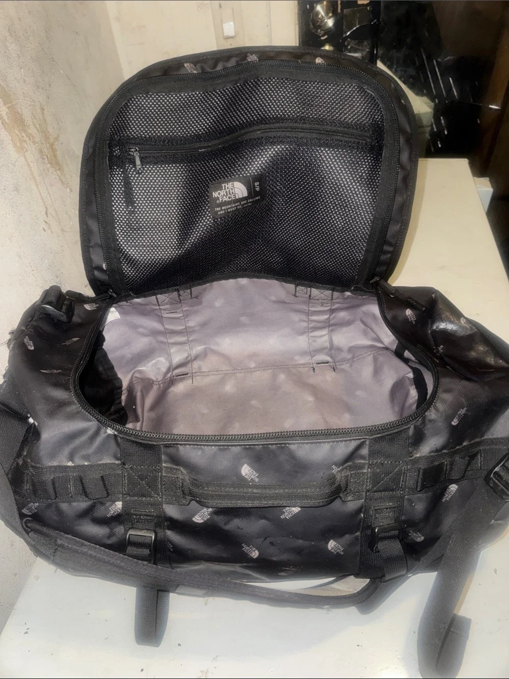 The North Face limited edition Black Duffel Messenger Bag with TNF logo repeat